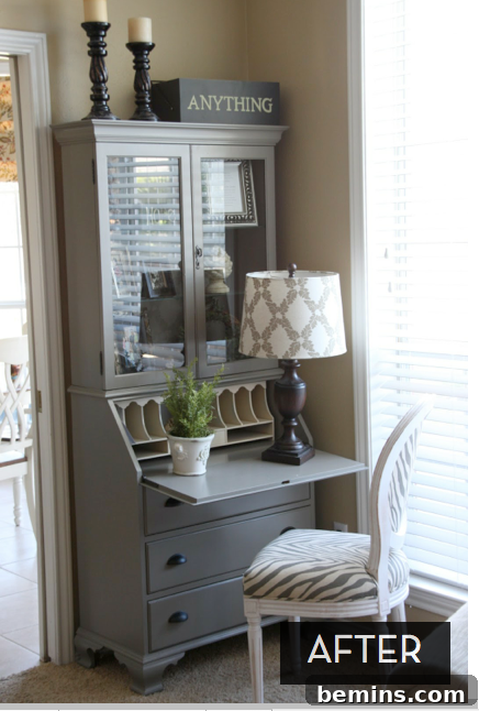 A tall gray cabinet has a lamp, plant and chair next to it.