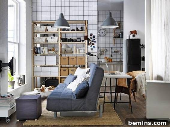 A living room with a blue sofa facing a window, allowing natural light to flood the space.