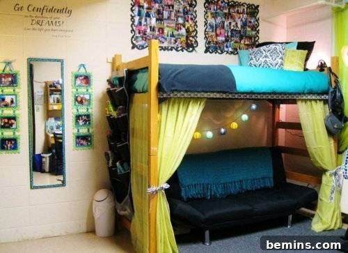 Two bunk beds with blue sheets, adorned with a yellow curtain, creating a cozy and personalized sleeping area.