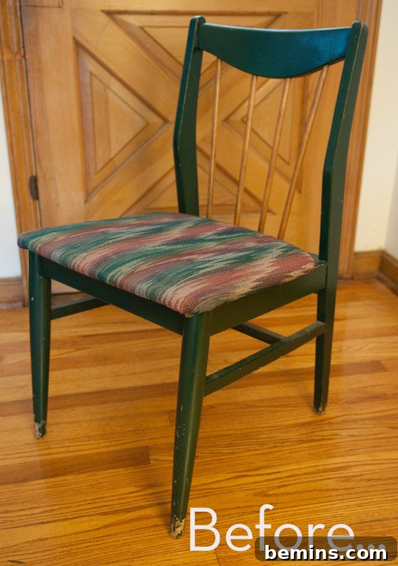A dining chair is green except for wood-color back slats. This chair will be revamped.