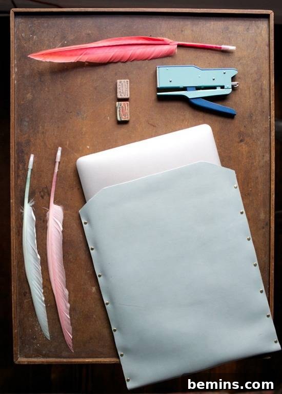 Leathercraft Dreams: 11 DIY Projects to Ignite Your Creativity 7 A brown tray has fabrics and several feathers on it.