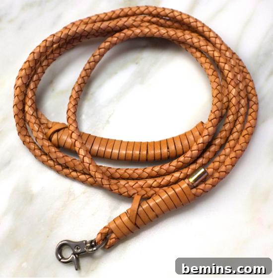 Leathercraft Dreams: 11 DIY Projects to Ignite Your Creativity 10 A braided rope that has a d link hook on the end of the rope.