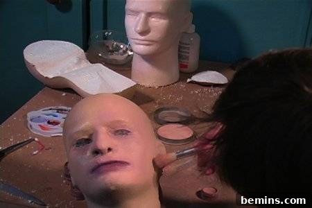 Duplicate head models is spread over the table.