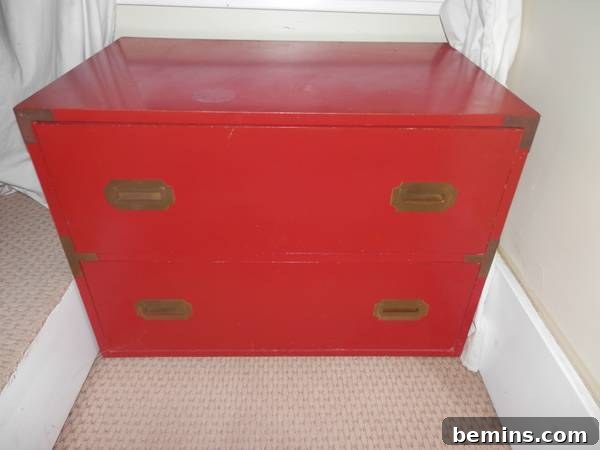 A vintage red trunk, an example of unique furniture finds that will be repurposed for the master bedroom.