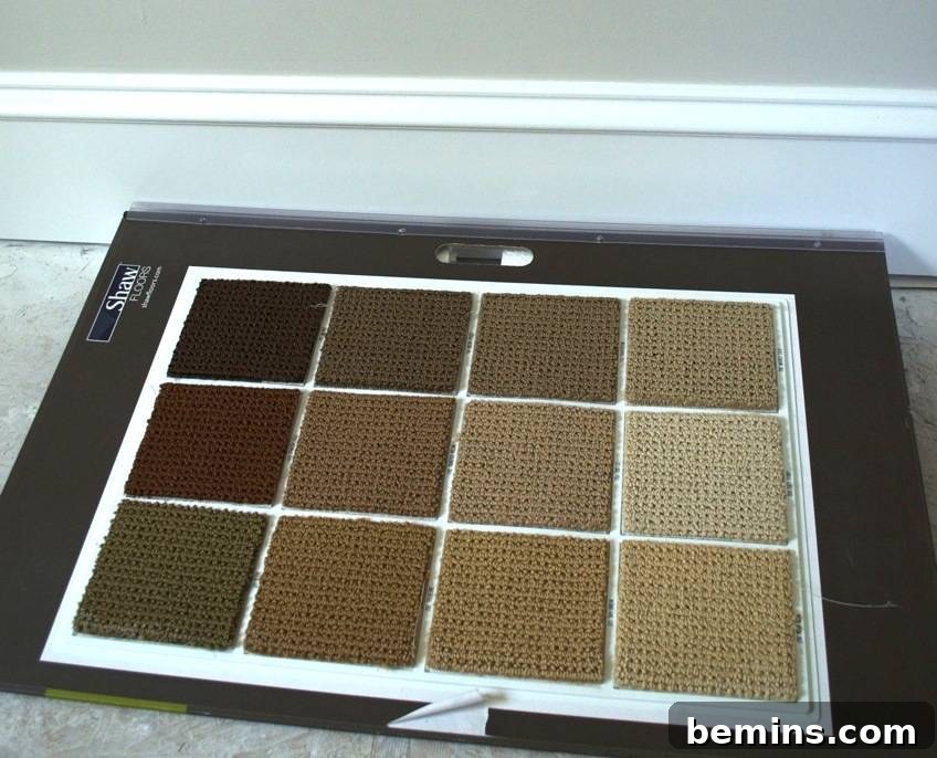 Square carpet samples displayed on a board, showcasing the chosen 'Artistic Sensibility' in 'Washed Silk' carpet.