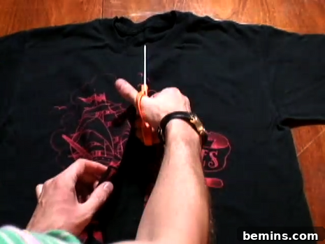 Cutting the t-shirt along the marked line.