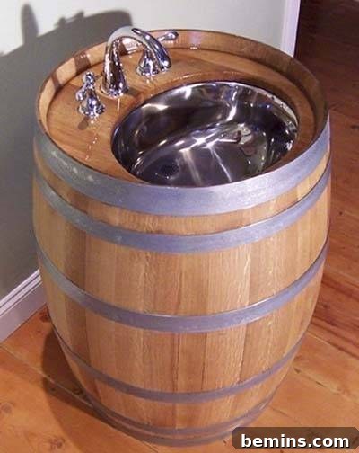 A sink made out wood and chrome sink faucet, highlighting a distinctive whiskey or wine barrel vanity.