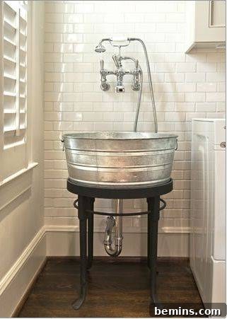 Galvanized tub on a stand next to a shuttered window, illustrating a charming repurposed laundry tub sink.
