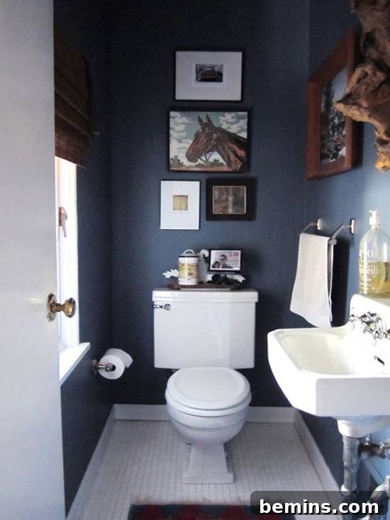 Dark Indulgence: 10 Bathrooms Embracing the Moody Palette 11 A moody bathroom with wooden accents, creating a masculine and sophisticated ambiance.