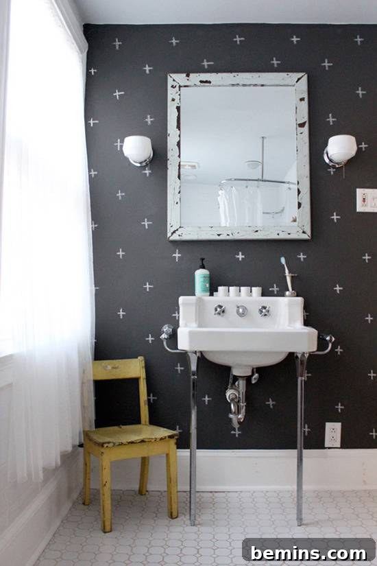 Dark Indulgence: 10 Bathrooms Embracing the Moody Palette 9 A bathroom with dark chalkboard paint walls, offering a customizable and artistic touch.