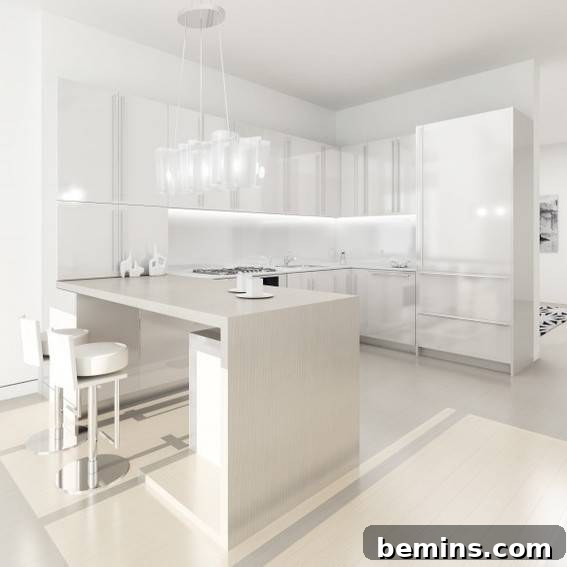 All white modern kitchen, with lots of cabinets and storage.