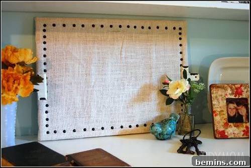 Two vases, photo frame and few other decorative items are lying near the wall.