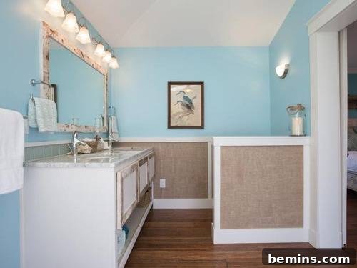 A bathroom has a lot of lighting and blue and brown walls.