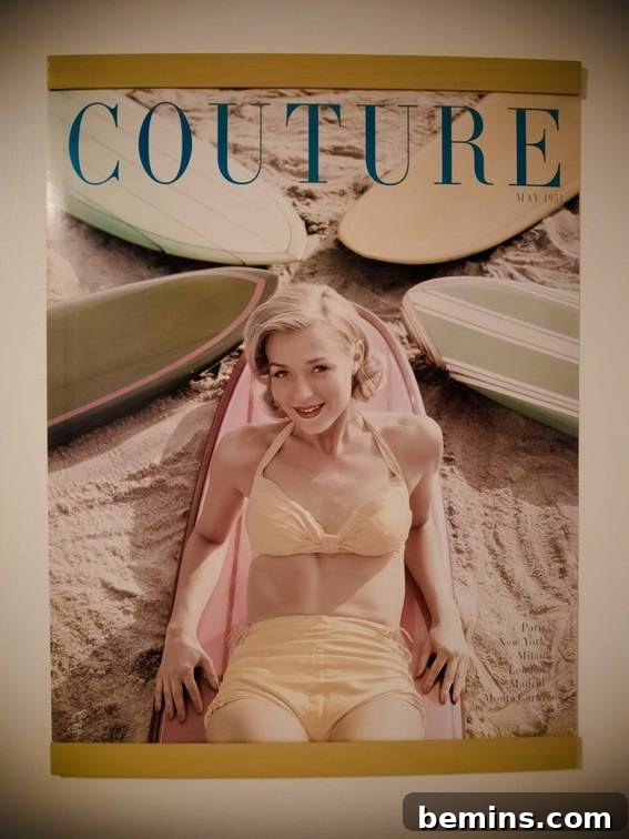 A stylish poster featuring a woman on a surfboard, held by a DIY poster hanger.