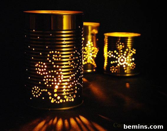 Holes punched in tin to make a light. DIY luminary project using recycled soup cans.