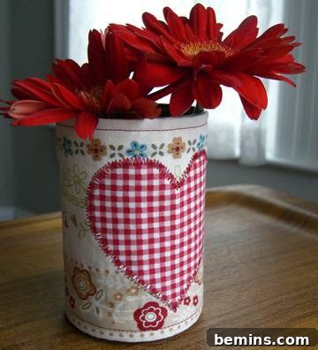 Flowers in a can with a fabric heart. Fabric-covered soup can craft project with a heart accent.