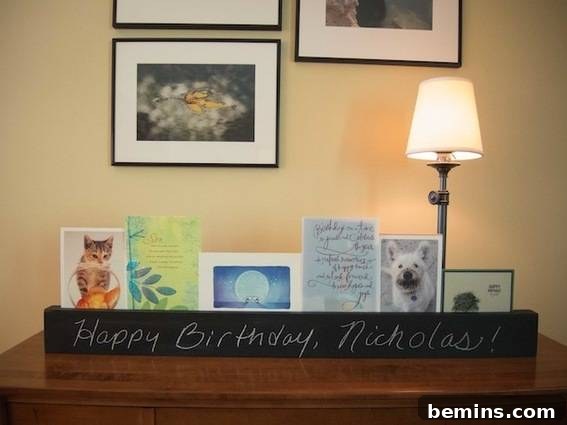 Craft a Rustic Chalkboard Card Display from Reclaimed Wood 12 Pictures hang on a yellow wall above a brown table. The chalkboard greeting card holder displayed on a table, showcasing its versatility and style.