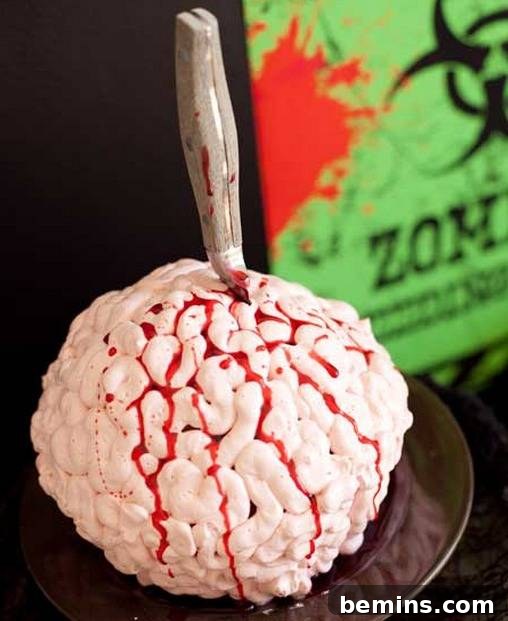 A knife is put through a fake brain on a tray.
