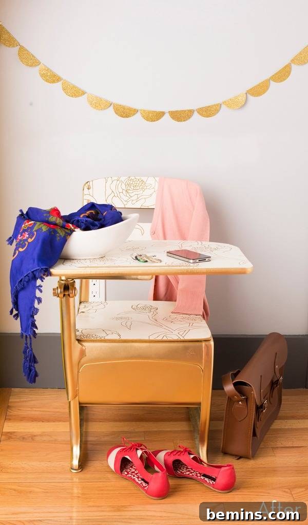 Things sit on a small desk in a grey room with a wooden floor.