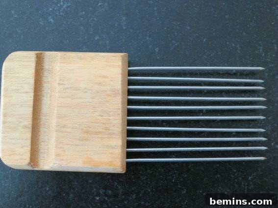 Old fashion pick brush with a wood handle, used for holding vegetables.