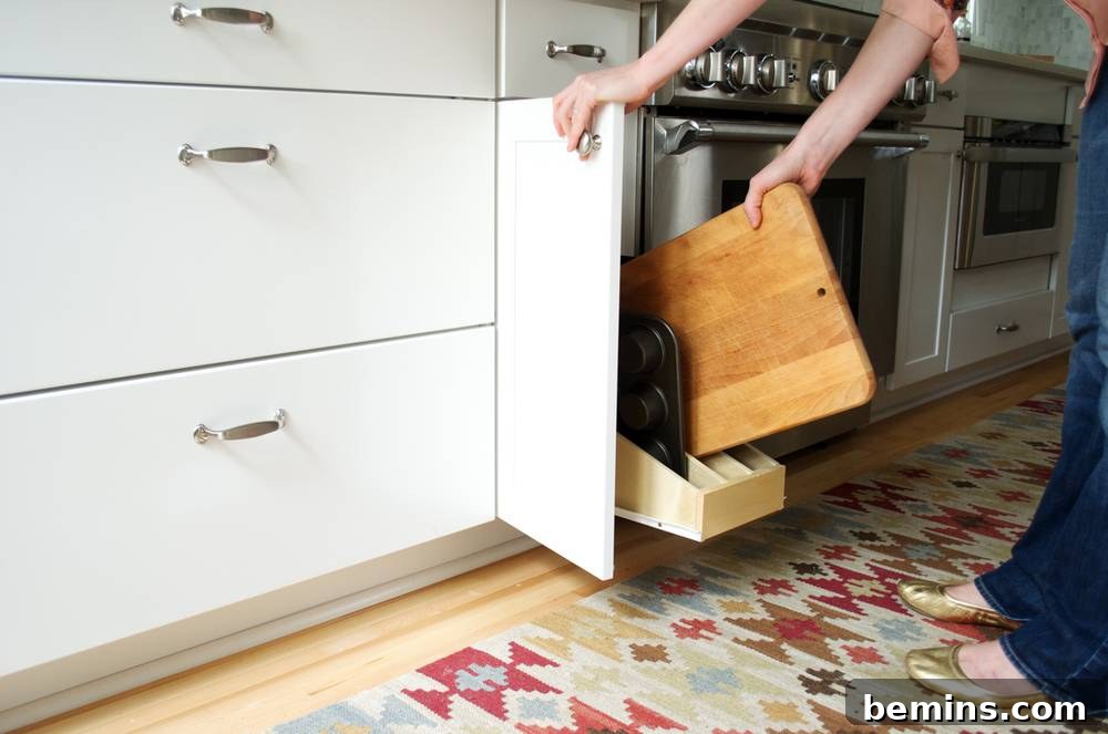 Person placing wood cutting board inside a shelf.