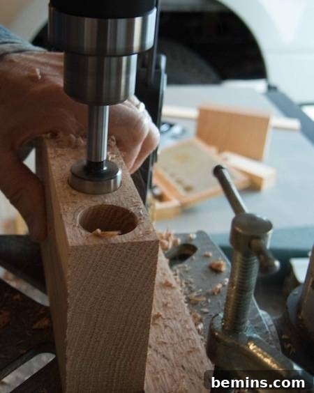 Drilling holes in the wood for the test tubes