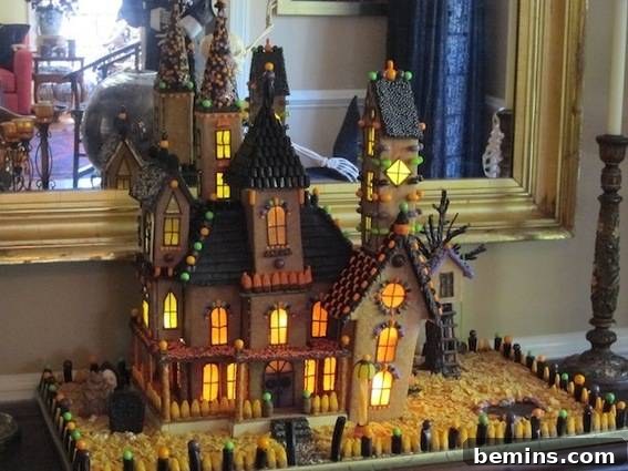 A model of a haunted house sits near a mirror.