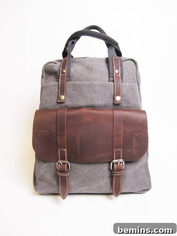 The Ultimate Gift List for Him: 12 Unique Handmade Presents 11 A grey satchel with brown leather accents and straps.