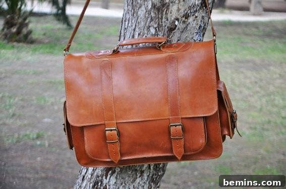 The Ultimate Gift List for Him: 12 Unique Handmade Presents 9 A brown leather purse hangs from a tree.