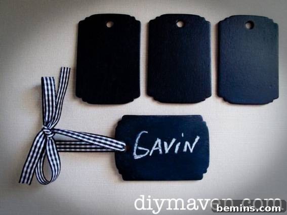 Black name tags sit on a white surface.