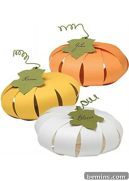 Paper made pumpkin in different colors.
