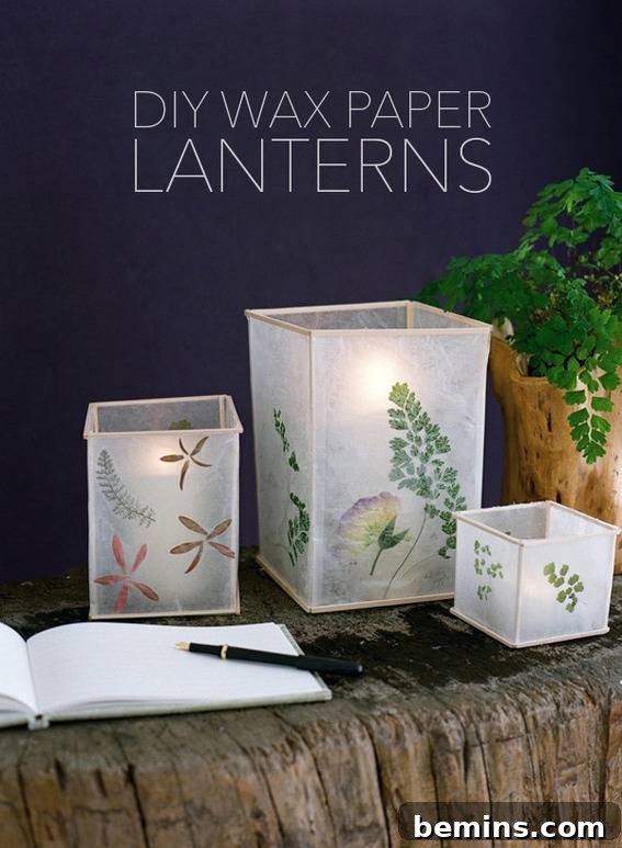 A cluster of handmade wax paper lanterns positioned against a soft blue wall, showcasing their delicate texture and warm light.