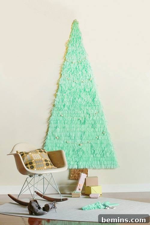A unique papier mache Christmas tree on a wall in a living room, offering a space-saving and festive alternative.