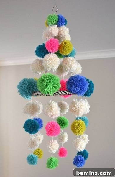 10 Ways to Add Pom-Pom Power to Your Decor & Crafts 4 Colorful pom-pom chandelier, a unique and whimsical lighting fixture.