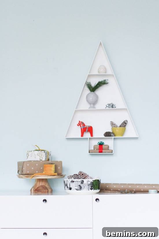 Animal and plant figurines stacked on Christmas tree shaped shelf.