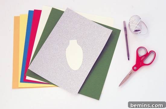 Many A-4 size papers of different colors are lying near a scissor, pen, and a thread. Preparing materials for a DIY Christmas light garland.