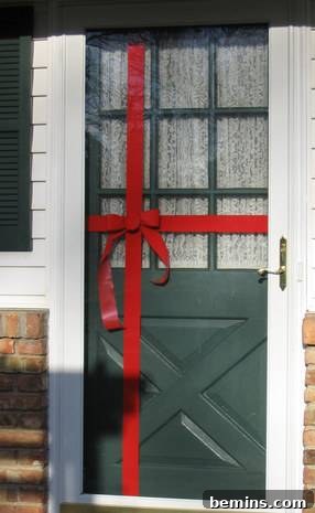 Gift-Wrapped Doorway: Budget-Friendly Christmas Cheer 3 Gift wrapped green color door for Christmas decoration.