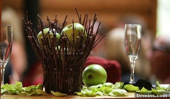 A table decorated with apple and few other items.