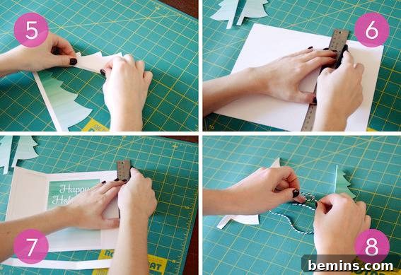 DIY Christmas Tree Card Tutorial Free Template 5 A person measuring and cutting out christmas trees for a Christmas card, showing precision crafting.