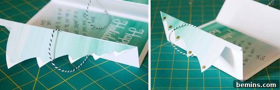 DIY Christmas Tree Card Tutorial Free Template 7 Folded paper is sitting on a green and yellow gridded surface, ready for final touches on a DIY Christmas card.