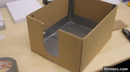 How to Craft a Realistic Replica Hand 2 Cardboard box with cutout on one side and duct taped interior