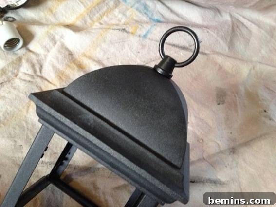Repainted and refinished light fixture. Showing the light fixture after repainting.