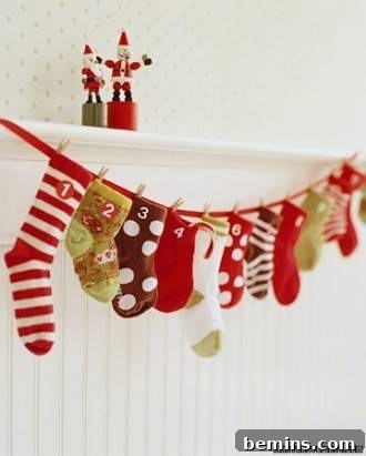 Colorful stockings hanging on a line against a white wall, functioning as a charming baby sock advent calendar, offering a delightful countdown to Christmas.