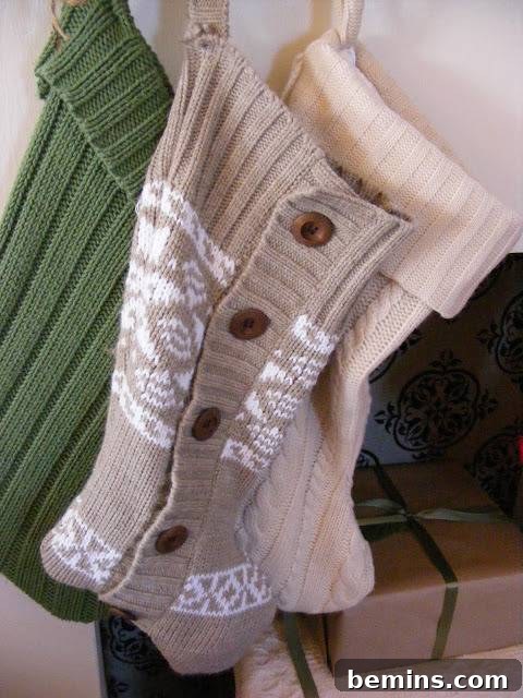 Stockings crafted from upcycled sweaters hanging from a white wall, showcasing a cozy and sustainable holiday craft project.