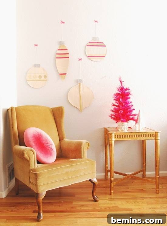A cute beige and pink room wit decorative ornaments on the wall.