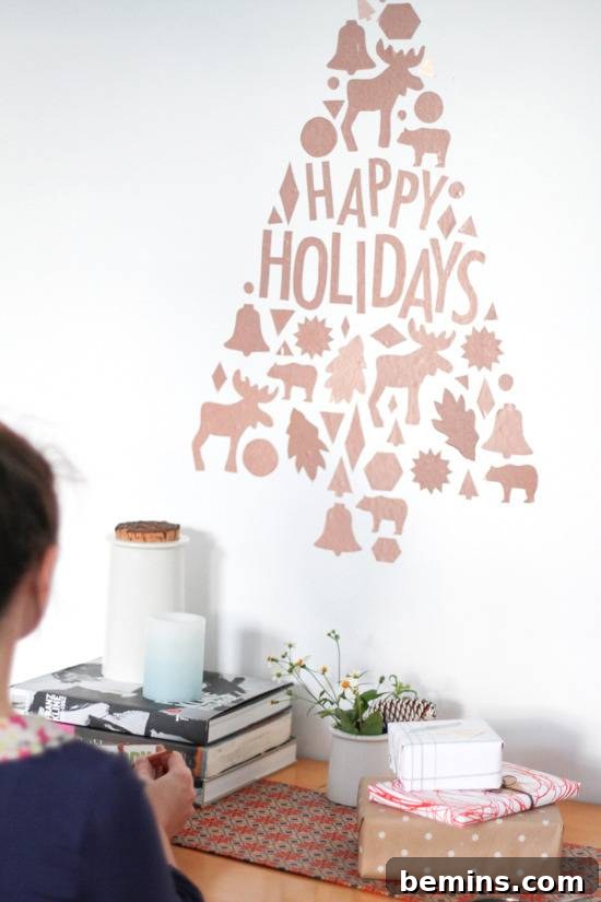 Craft Your Own Festive Wall Decor: Removable Decal Magic 7 Vinyl Christmas tree with moose, elk, leaves, and bells that says "Happy Holidays". Creative and unique DIY holiday wall decoration.