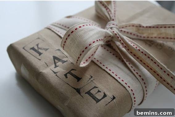 Gift Wrapping Extravaganza: 10 Creative Ideas and Tutorials 12 A wrapped present is stamped with the receiver's name in large black letters