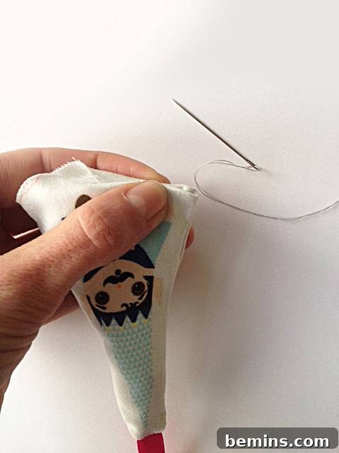 Close-up of the hand sewing technique for a blind stitch