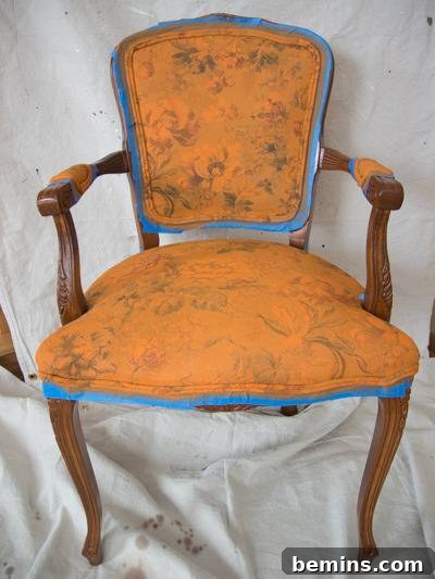 Vintage chair being upholstered with Annie Sloan chalk paint, after two coats.