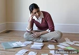 10 Items to Ditch for a Clutter-Free Home 5 A woman thinking out to create a more organized space, illustrating the decluttering process.
